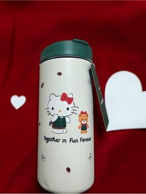 Hello Kitty White & Green Stainless Kids Bottle with Red Bow Print